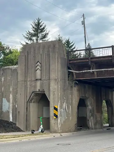 Modern wheels meet brutalist concrete.
